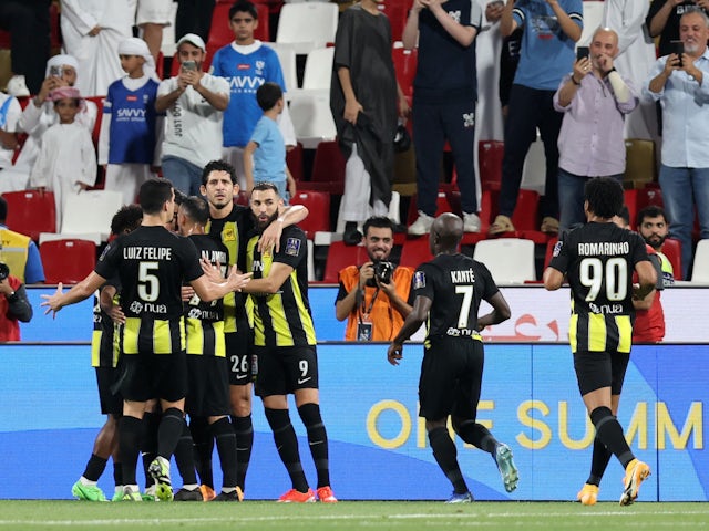 Al Ittihad's Abderrazak Hamdallah celebrates scoring their first goal with teammates on April 11, 2024