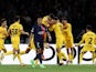 Barcelona's Andreas Christensen celebrates scoring their third goal with teammates as Paris Saint-Germain's Kylian Mbappe looks dejected on April 10, 2024