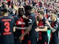 Bayer Leverkusen's Victor Boniface celebrates scoring their second goal with teammates on April 11, 2024