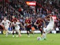 Manchester United's Bruno Fernandes scores a penalty against Bournemouth on April 13, 2024