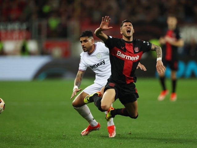 West Ham United's Emerson Palmieri in action with Bayer Leverkusen's Exequiel Palacios on April 11, 2024