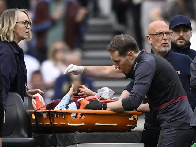 West Ham United's George Earthy is stretchered off after sustaining an injury on April 14, 2024