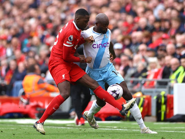 Liverpool's Ibrahima Konate in action with Crystal Palace's Jean-Philippe Mateta on April 14, 2024