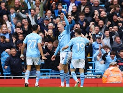 Manchester City's Erling Haaland, Matheus Nunes and Julian Alvarez celebrate after Luton Town's Daiki Hashioka scores an own goal  on April 13, 2024