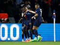 Paris Saint-Germain's Ousmane Dembele celebrates scoring their first goal with teammates on April 10, 2024