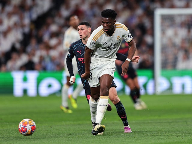 Real Madrid's Aurelien Tchouameni in action with Manchester City's Phil Foden on April 9, 2024