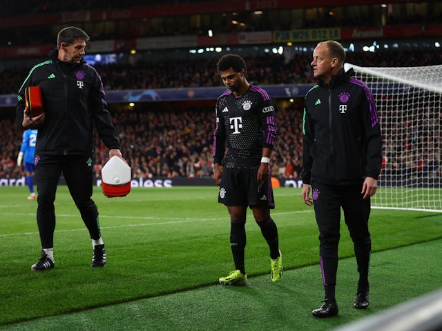 Bayern Munich's Serge Gnabry walks off the pitch after sustaining an injury on April 9, 2024