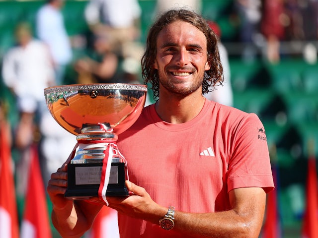 Greece's Stefanos Tsitsipas celebrates with the Monte Carlo Masters trophy on April 14, 2024