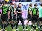 Wolfsburg coach Ralph Hasenhuttl with players look dejected after the match on April 13, 2024
