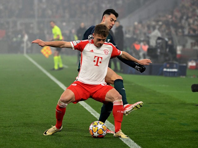 Bayern Munich's Joshua Kimmich in action with Arsenal's Gabriel Martinelli on April 17, 2024