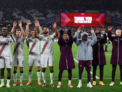 Bayer Leverkusen players celebrate with their fans after the match on April 18, 2024