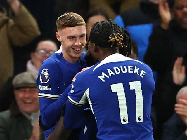 Chelsea's Cole Palmer celebrates scoring their first goal with Noni Madueke on April 15, 2024