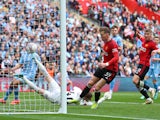 Manchester United's Scott McTominay scores against Coventry City on April 21, 2024