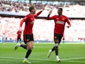 Manchester United's Scott McTominay celebrates scoring against Coventry City with Marcus Rashford on April 21, 2024
