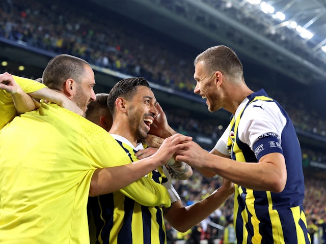 Fenerbahce's Irfan Can Kahveci celebrates scoring their first goal with teammates on April 18, 2024
