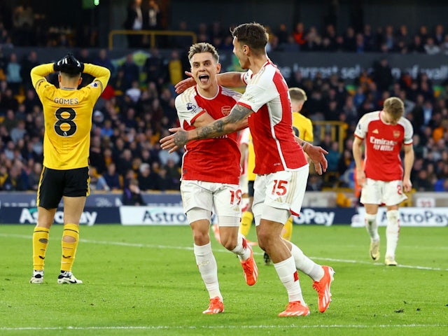 Arsenal see off Wolves to move to Premier League summit