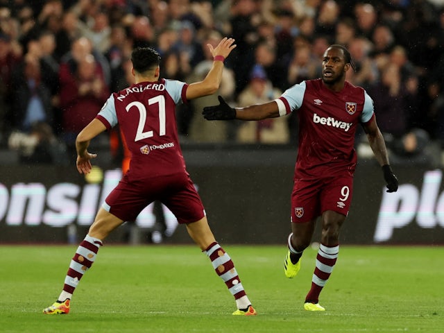 West Ham United's Michail Antonio celebrates scoring their first goal with Nayef Aguerd on April 18, 2024