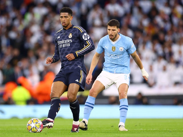 Real Madrid's Jude Bellingham in action with Manchester City's Ruben Dias on April 17, 2024