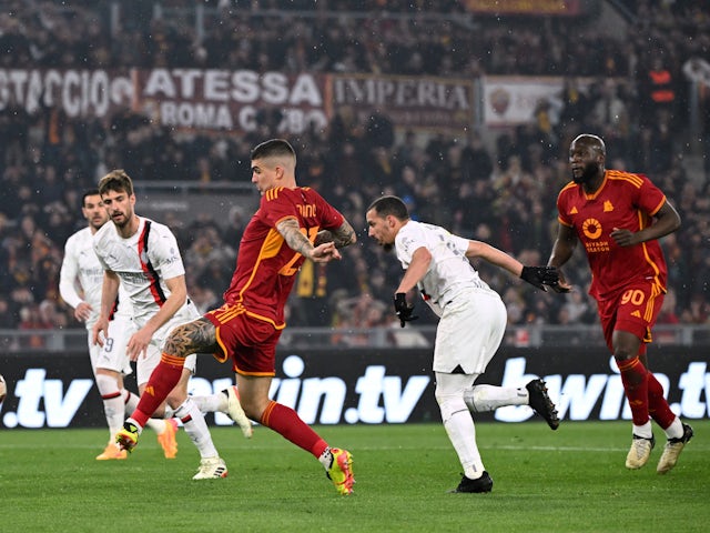 Roma's Gianluca Mancini scores against AC Milan on April 18, 2024
