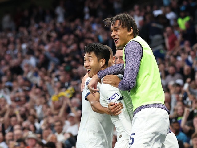 Tottenham Hotspur's Son Heung-min celebrates scoring their first goal with Ashley Phillips on September 30, 2023