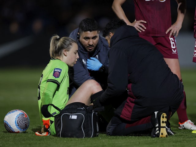 Aston Villa Women's Sophia Poor receives medical attention on April 17, 2024