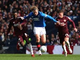 Rangers' Todd Cantwell in action with Hearts' Beni Baningime and Cameron Devlin on April 21, 2024