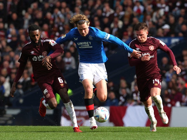 Rangers' Todd Cantwell in action with Hearts' Beni Baningime and Cameron Devlin on April 21, 2024
