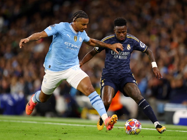 Real Madrid's Vinicius Junior in action with Manchester City's Manuel Akanji on April 17, 2024
