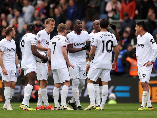 West Ham United's Kurt Zouma with teammates react after Crystal Palace scores a third goal on April 21, 2024