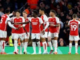 Arsenal players celebrate scoring their first goal on April 23, 2024