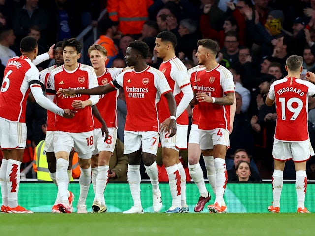 Arsenal players celebrate scoring their first goal on April 23, 2024