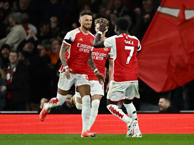 Arsenal's Ben White celebrates scoring their second goal with Martin Odegaard and Bukayo Saka on April 23, 2024