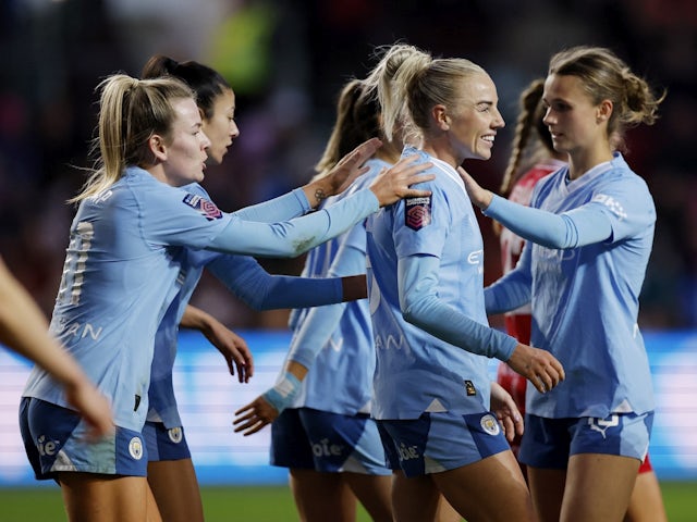 Manchester City Women's Alex Greenwood celebrates scoring their fourth goal with teammates on April 28, 2024