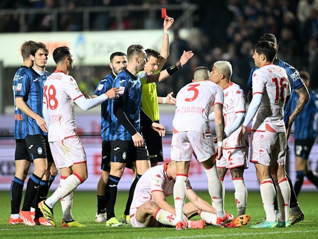 Fiorentina's Nikola Milenkovic is shown a red card by referee Federico La Penna on April 24, 2024