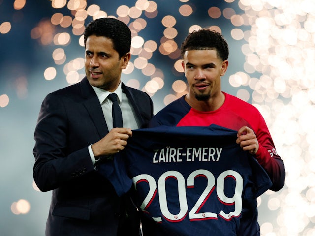 Paris Saint-Germain's Warren Zaire-Emery poses on the pitch before the match after signing a new contract with president Nasser Al-Khelaifion April 27, 2024