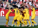 Barcelona players celebrate after Andreas Christensen scores their first goal on May 4, 2024
