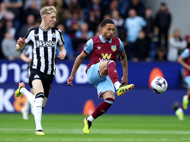 Newcastle United's Anthony Gordon in action with Burnley's Vitinho on May 4, 2024