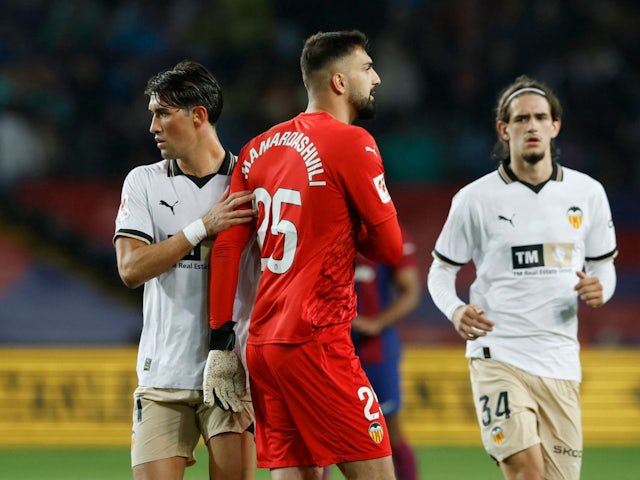 Valencia's Giorgi Mamardashvili walks of the pitch after being shown a red card on April 29, 2024