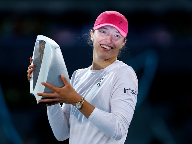 Iga Swiatek poses with the trophy after winning the Madrid Open on May 4, 2024