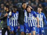 Brighton & Hove Albion's James Milner, Joao Pedro and Carlos Baleba celebrate after the match on December 14, 2023