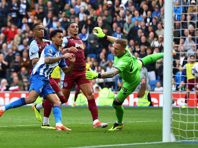 Aston Villa's Robin Olsen saves a penalty before Brighton & Hove Albion's Joao Pedro scores the rebound for their first goal on May 5, 2024
