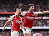 Arsenal's Leandro Trossard celebrates scoring their second goal with Declan Rice on May 4, 2024