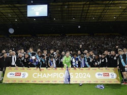 Leicester City players celebrate on the pitch after winning the Championship on April 29, 2024