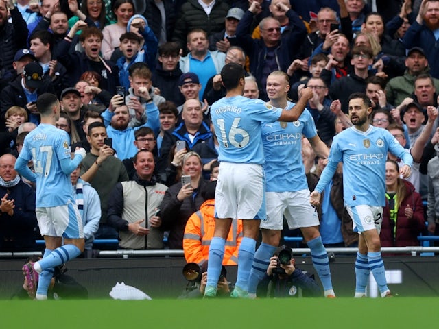 Manchester City's Erling Haaland celebrates scoring their first goal with Bernardo Silva and Rodri on May 4, 2024