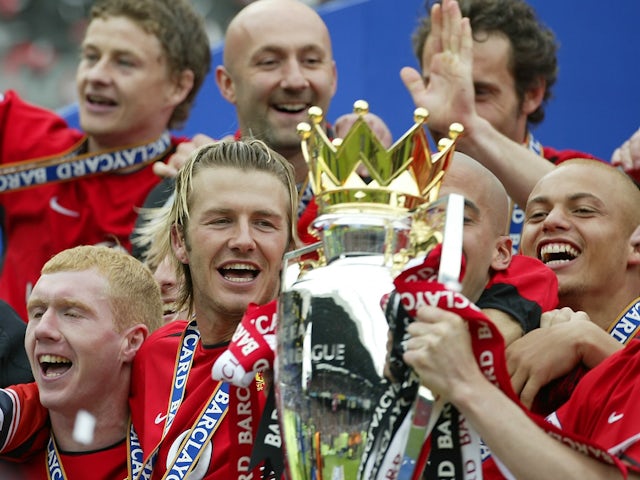 Manchester United players celebrate winning the Premier League in 2002-03