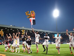 Bayer Leverkusen players celebrate their 50th undefeated match on May 12, 2024