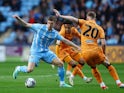 Coventry City's Ben Sheaf in action with Hull City's Liam Delap on April 24, 2024