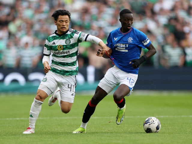 Celtic's Reo Hatate in action with Rangers' Mohamed Diomande on May 11, 2024