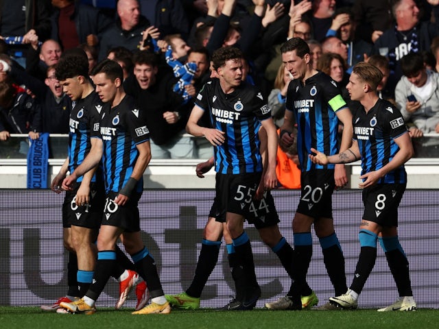Club Brugge's Maxim De Cuyper celebrates scoring their first goal with teammates on May 8, 2024