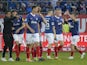 Holstein Kiel's Benedikt Pichler celebrates scoring their first goal with teammates and coach Marcel Rapp on May 11, 2024